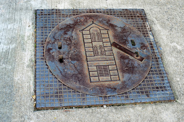 Old square manhole on the ground