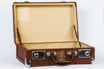 A brown suitcase. Vintage luggage. Vintage travel bag. Isolated on white background.
