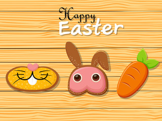 Happy Easter rabbit carrots shape cookies on brown wooden background