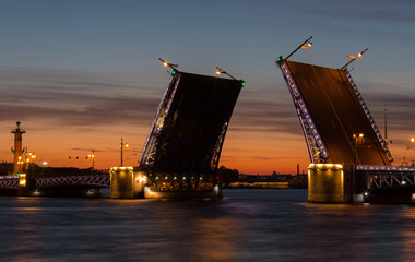 Fototapeta na wymiar Open Dvortsovy Bridge and view of the Spit of Vasilyevsky Island, Saint-Petersburg, Russia