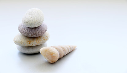 Stack of stones and Shell on the table
