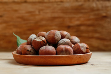 hazelnuts in wooden plate