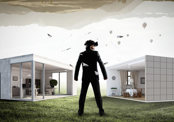 Man in virtual helmet . Mixed media