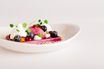 Dessert in a restaurant with bavarois, ice-cream and berry's
