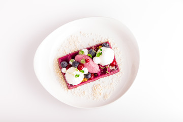 Dessert in a restaurant with bavarois, ice-cream and berry's