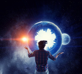 Man in virtual helmet . Mixed media