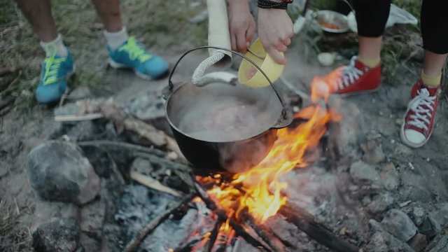 Cooking food on a campfire in forest.Camp life.Traveling.