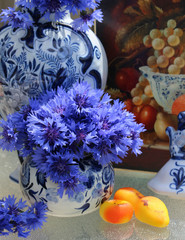 blue cornflowers, delft blue pottery, still life dutch painting background