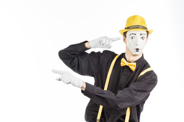 Portrait of a man, an artist, a pantomime. Shows something, isolated on white background