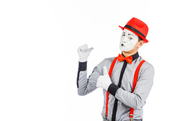 Portrait of a man, an artist, a pantomime. Shows something, isolated on white background