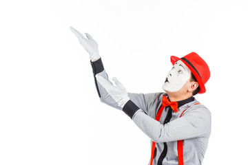 Portrait of a man, an artist, a pantomime. Shows something, isolated on white background
