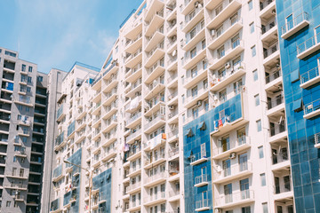 Fototapeta premium Wall Of New Modern Multi-storey Residential Building House In Residential Building House