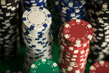 Casino theme. casino roulette, poker game, dice game, poker chips on a gaming table,  Place for typography and logo.