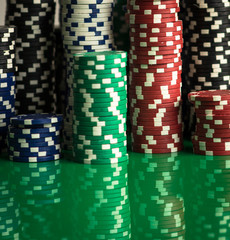 Casino theme. casino roulette, poker game, dice game, poker chips on a gaming table,  Place for typography and logo.