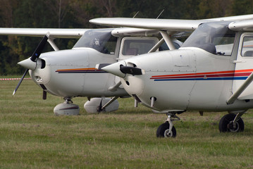 Fototapeta na wymiar Airplanes on the grass airfield