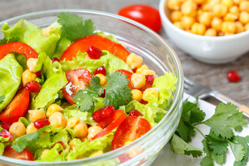 Healthy homemade vegan chickpea salad with vegetables. Love for a healthy vegan food concept