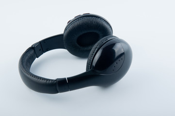 Modern black headphones white background