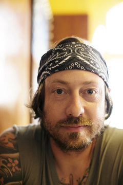 Portrait of tattooed mature man