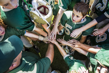 Boys (10-11) greeting before american football match