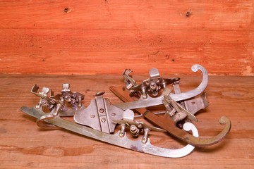 Vintage ice skates on wooden background