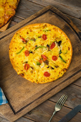 pizza top view in rustic setting