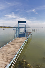 Lake Balaton landscape with closed long pier for boats, Hungary.