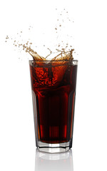 Splash in glass of cola with ice