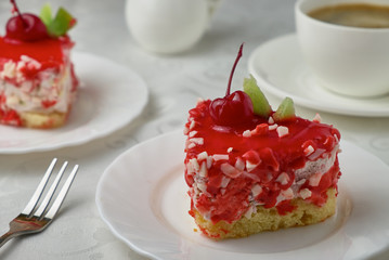 Delicious dessert cake with cream and cherry