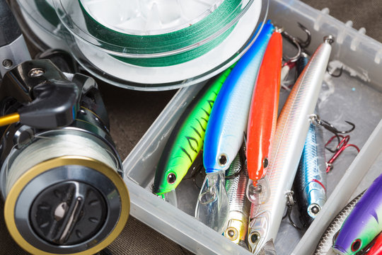 Closeup of a fishing box with colorful lures.