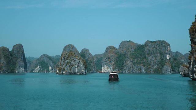 Beautiful views of Ha long Bay from the upper deck of the ship. Ha Long Bay is a UNESCO World Heritage Site and popular travel destination. Full HD slow motion stock footage. 
