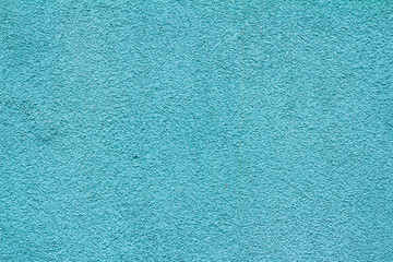Texture of blue plaster with traces of dirty streaks