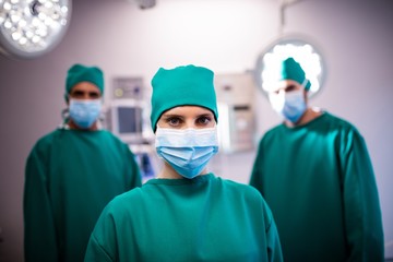 Fototapeta na wymiar Portrait of medical team standing in a operating room