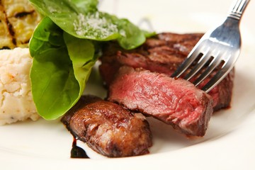 beef tenderloin steak wiht fork
