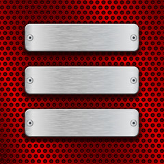 Blank metal plates on red perforated background