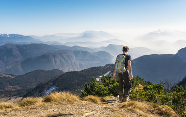 Fototapeta premium Man walking hiking on mountain trail. Great view.