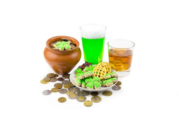 Clay pot with coins green beer whiskey Scotch and clover. The day of St. Patrick