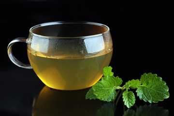 Herbal dry sri lanka tea. Mint leaf. Tea in a glass cup, mint leaves, dried tea, in a restaurant or teahouse