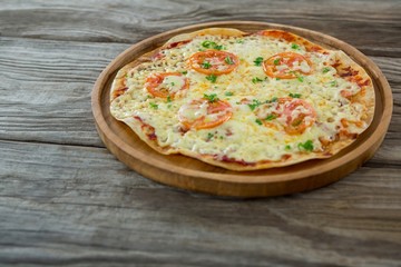 Italian pizza on a wooden plank