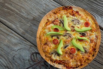Italian pizza served on a wooden plank