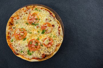 Italian pizza served in a pizza tray