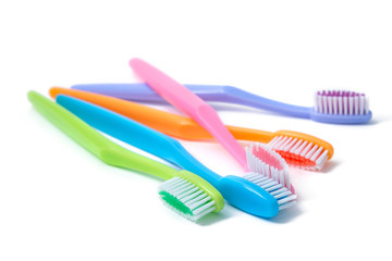 colorful toothbrushes isolated on white