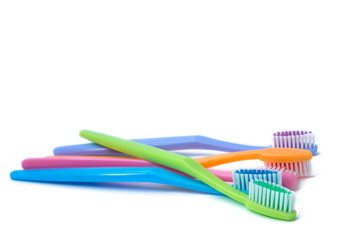 colorful toothbrushes isolated on white
