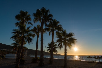 Obraz na płótnie Canvas sunset over a sunny beach