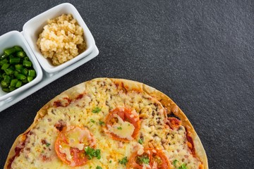 Italian pizza served with ingredients