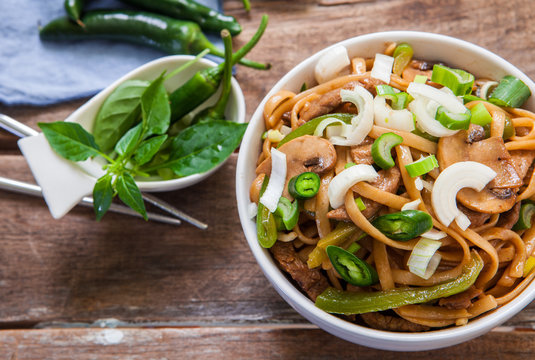 Thai beef noodles with green chili and onions
