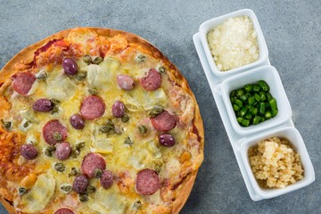 Italian pizza served with various ingredients