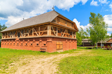 Fototapeta na wymiar Old traditional mill building in Tokarnia village on sunny spring day, Poland