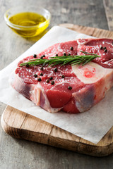 Raw meat on wooden background
