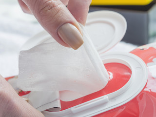 Wet wipes in a woman's hand.