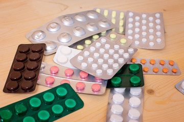 Medical tablets, antibiotics, capsules and pills on the table
